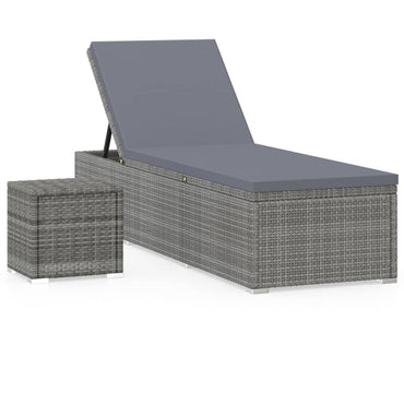 Silla larga con cojín y mesa de resina trenzada gris
