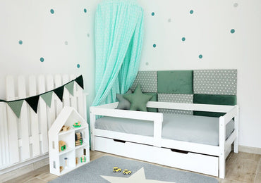 Simple white children's bed with drawer