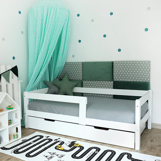 Simple white children's bed with drawer