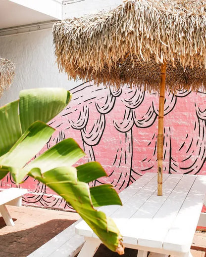 Bamboo parasol with banana leaf roof