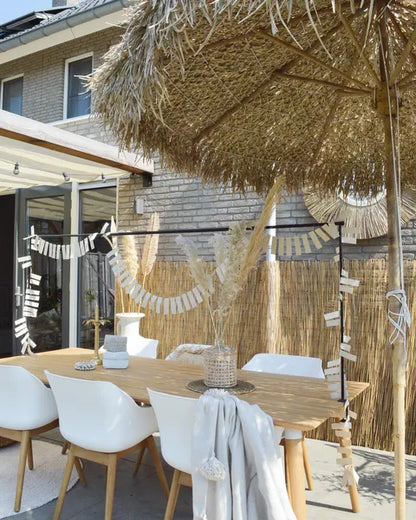 Bamboo parasol with banana leaf roof