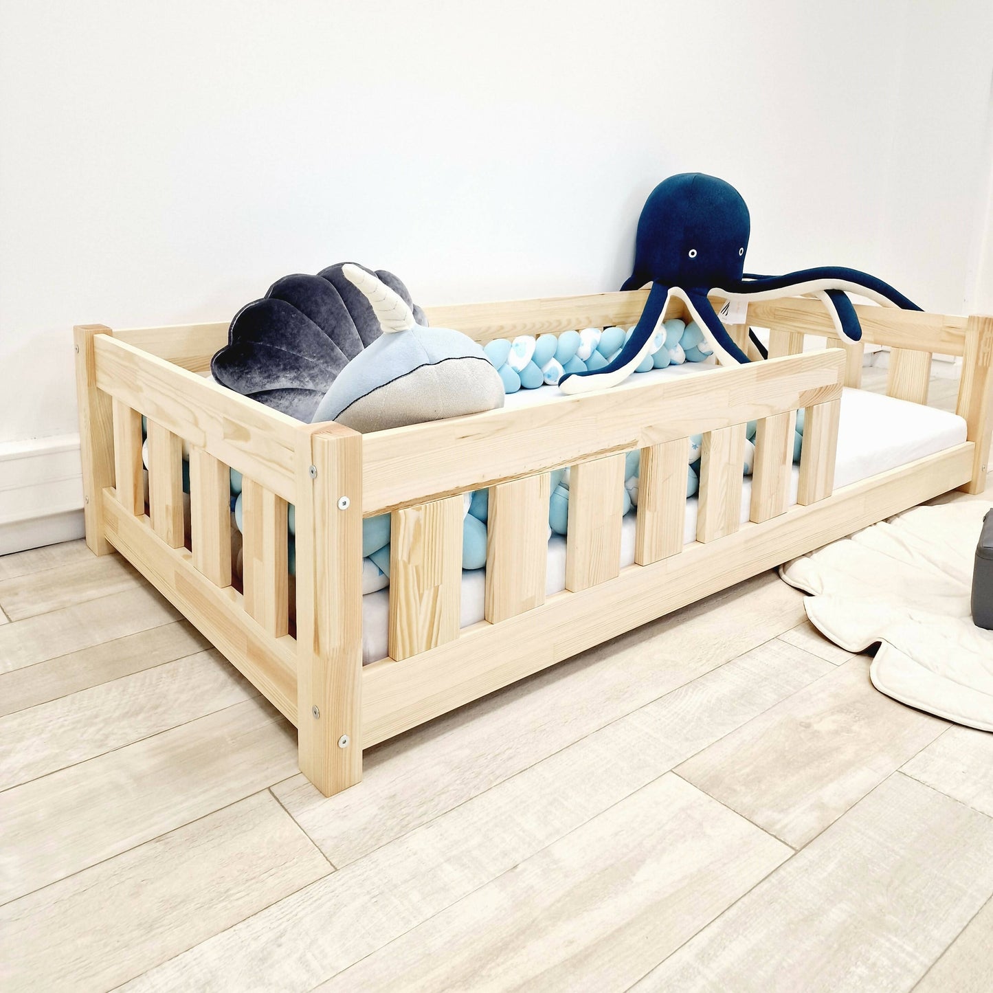 Simple children's bed with bars